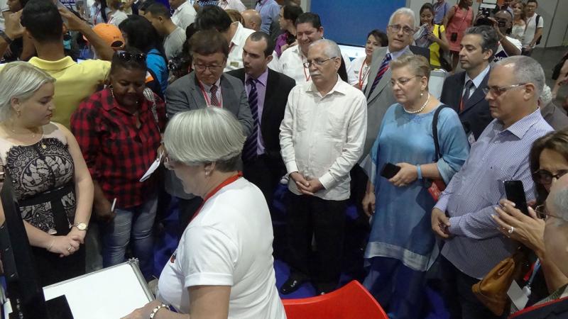 The opening included a tour of the fair by the presidency, which started at UCI exhibition booth